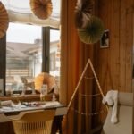 Warm wooden room interior featuring creative decor elements and natural light.