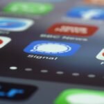 Detailed view of various app icons on a smartphone screen highlighting Signal app.